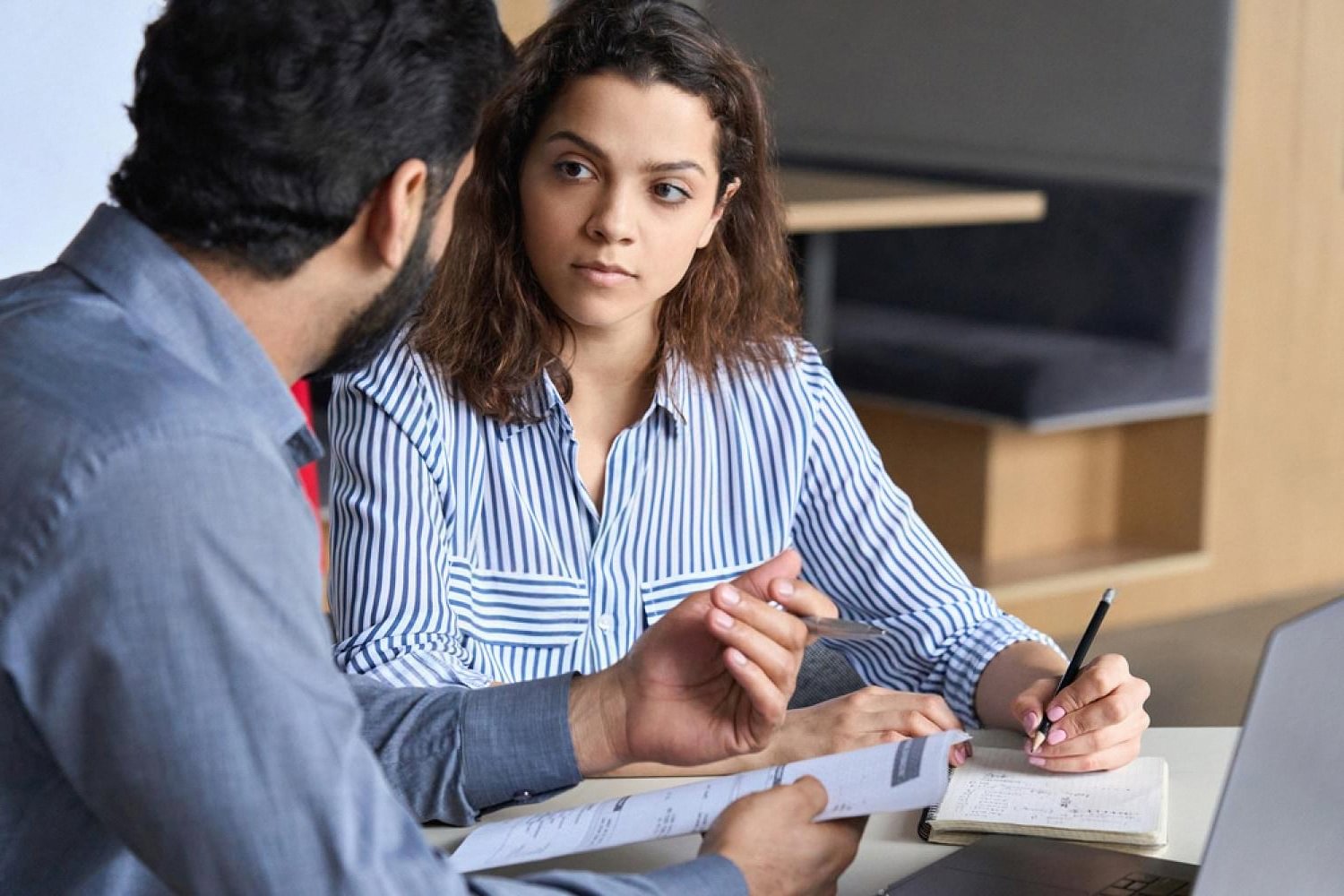 HR manager interviewing a candidate in a modern UAE office setting
